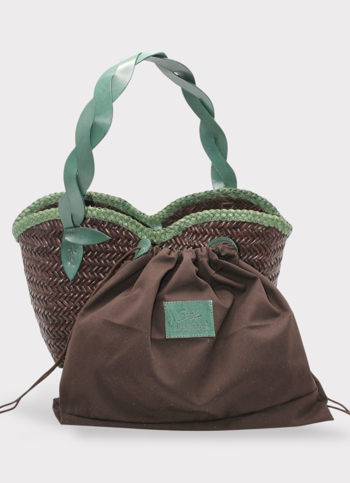 Léafa - Handwoven Leather Shoulder Bag | Green & Coffee featuring braided green leather handles and woven brown leather body with fabric pouch front