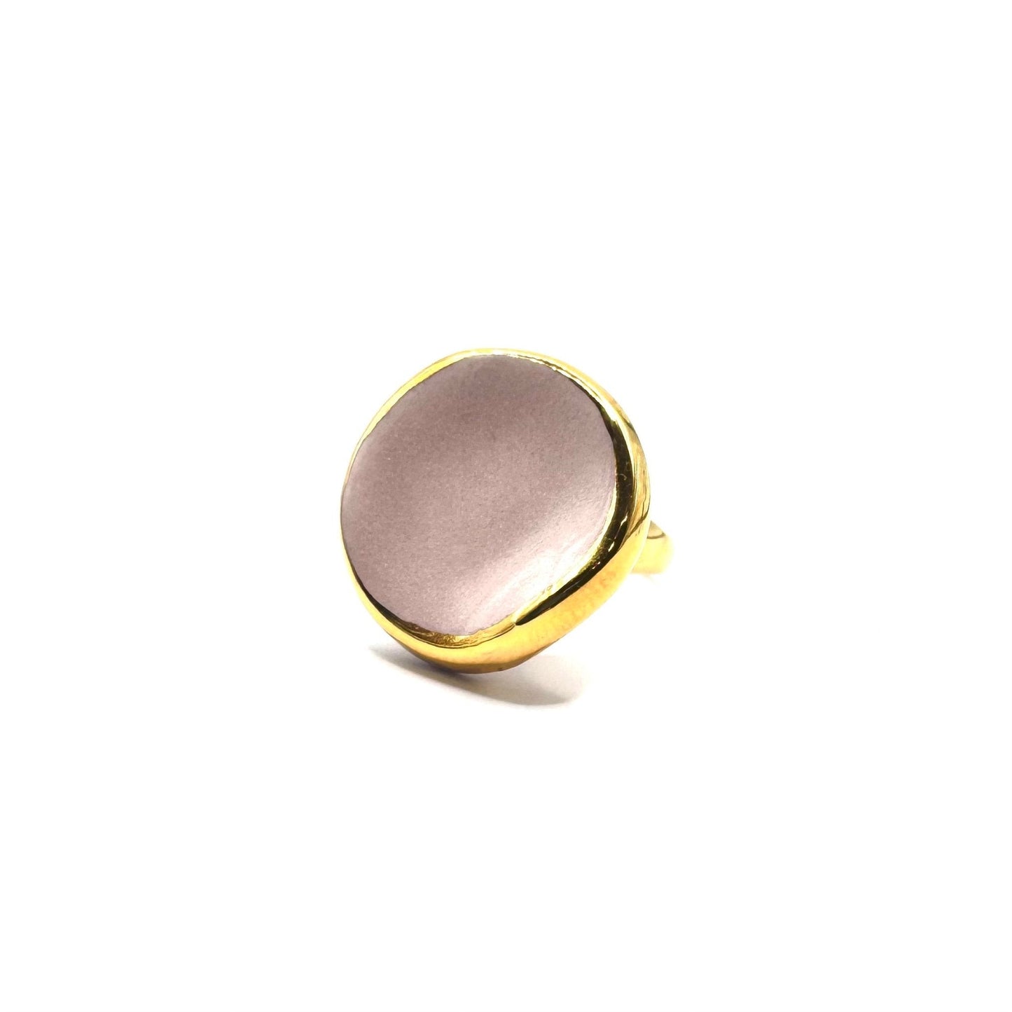 Pink ceramic ring with gold bezel and a soft lustrous finish