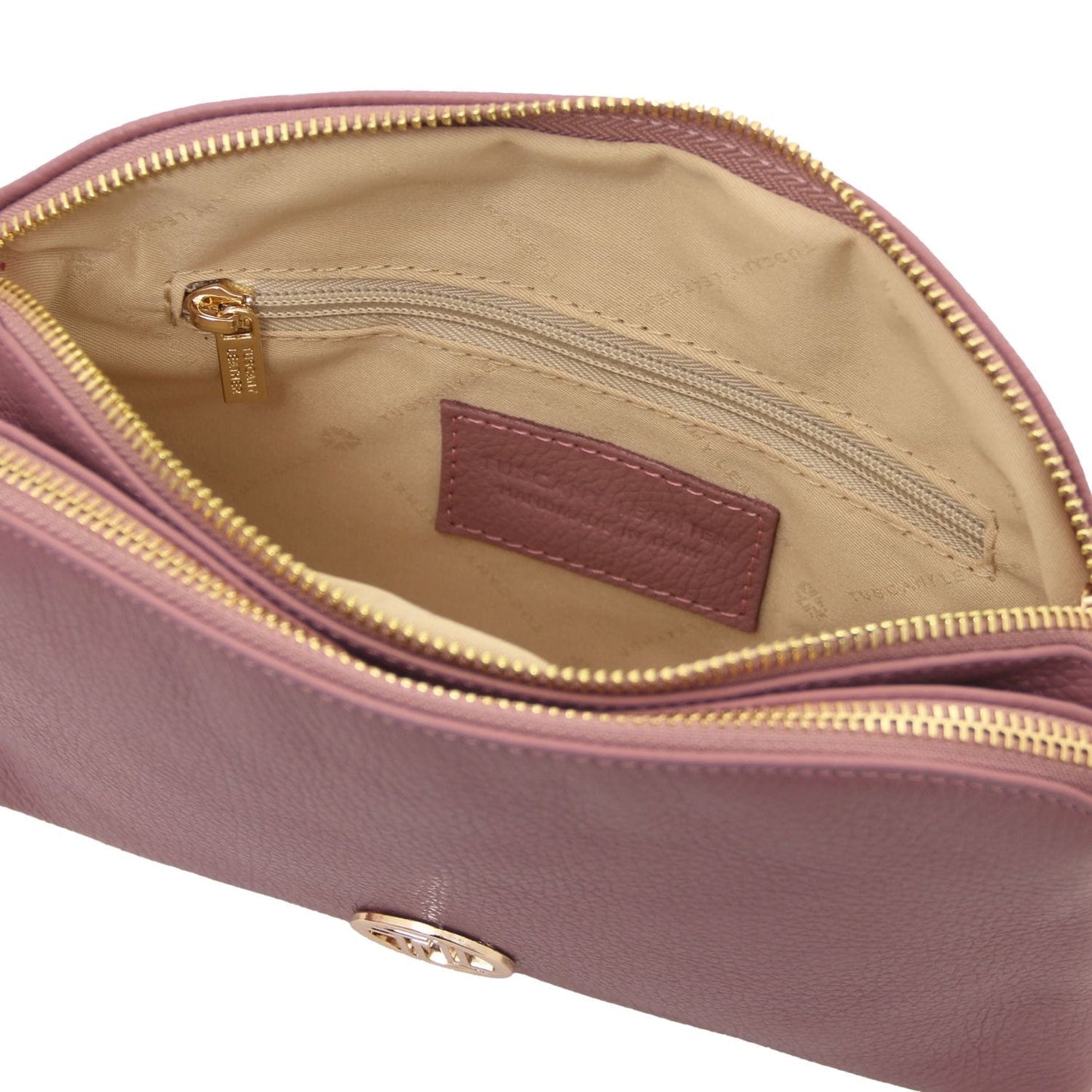 Interior view of Lily bag with beige lining, zip pocket and leather label