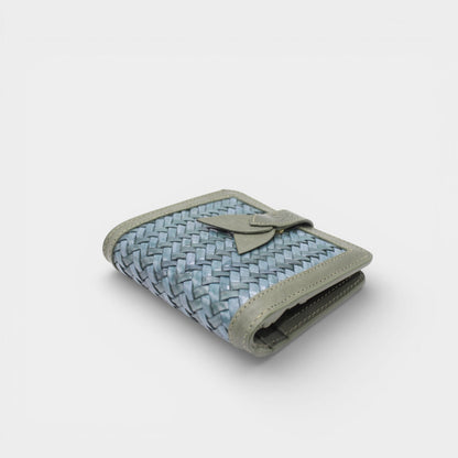Lumi - Handwoven Leather Wallet | Avocado & Teal displaying woven teal leather with smooth avocado leather trim and a tab closure detail.