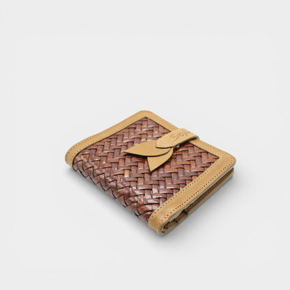 Lumi - Handwoven Leather Wallet | Taupe & Coffee featuring woven coffee leather with smooth taupe trim and decorative tab closure on plain surface.