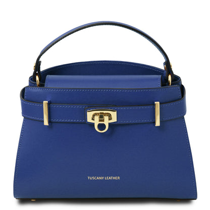 Blue top handle handbag with gold accents on a white background