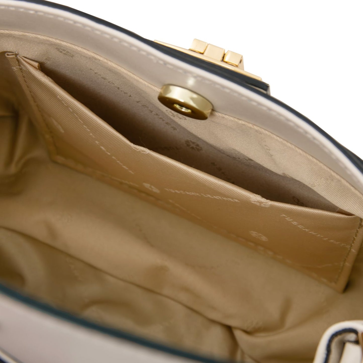 Inside view of Maisy bag showing main compartment and a stitched side slip pocket.