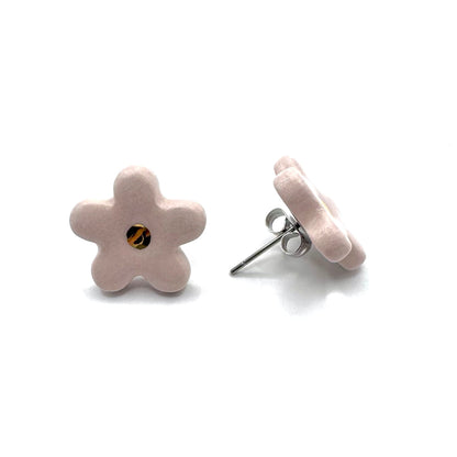 Pink ceramic flower stud with a gold center