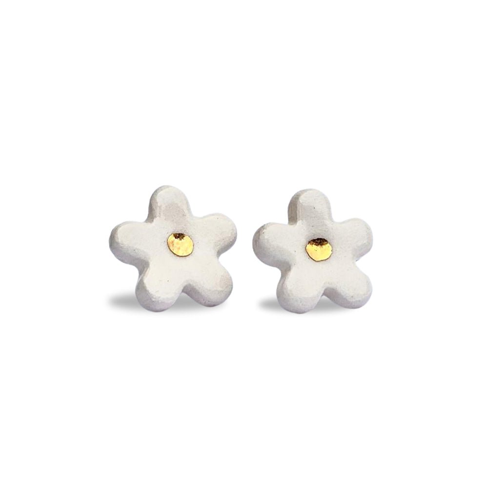 White ceramic flower stud earrings with gold centers