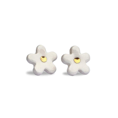 White ceramic flower stud earrings with gold centers