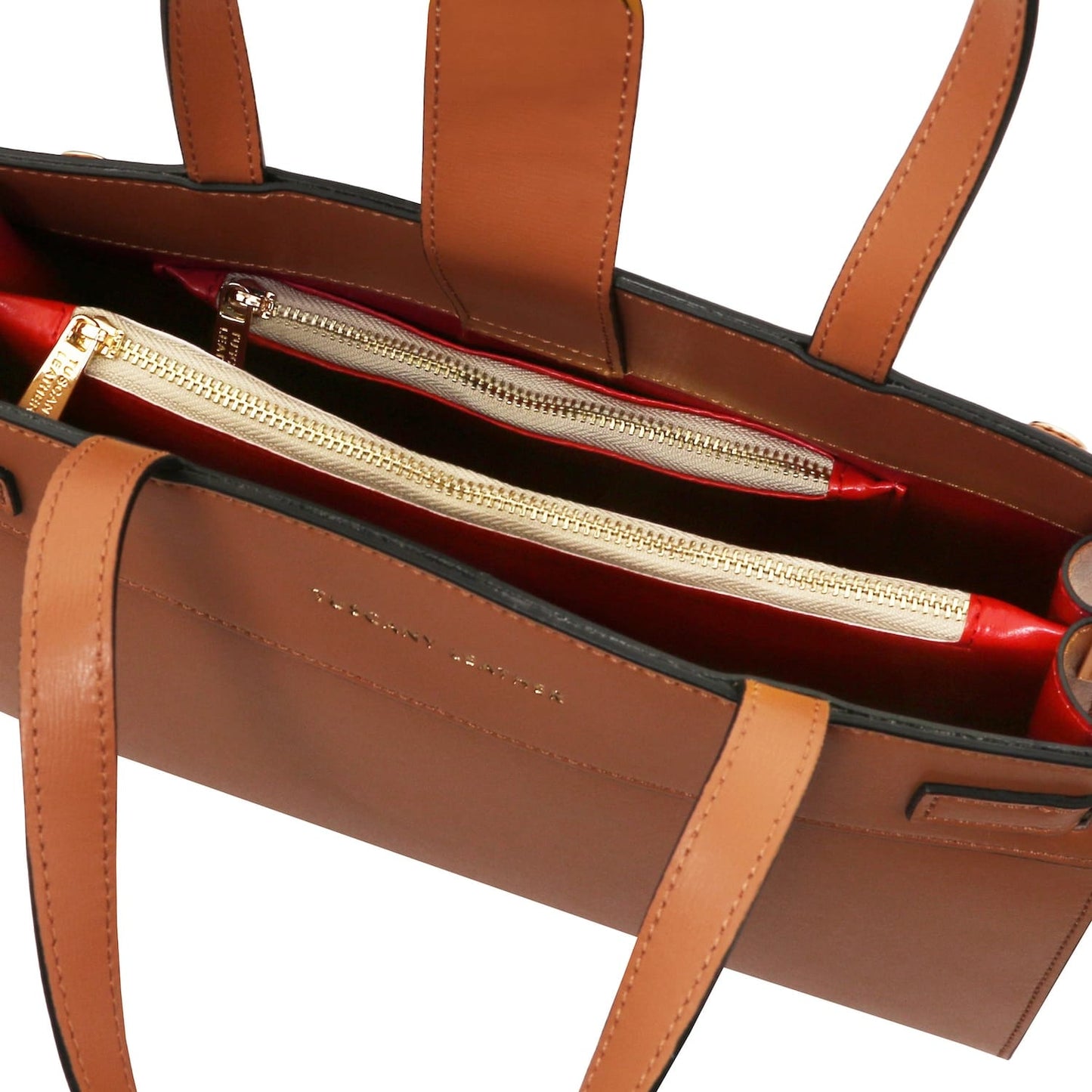 Interior of Musa Italian leather handbag with red lining and gold zippers