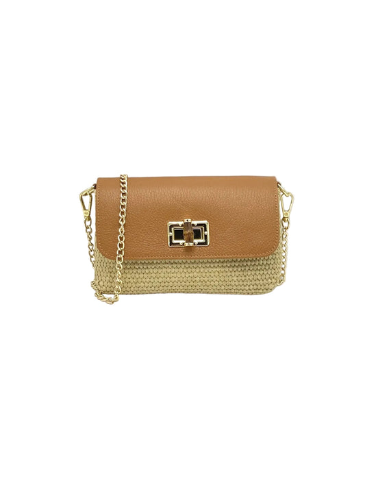 Raffia and leather shoulder bag with a tan leather flap and gold hardware on a delicate chain strap.
