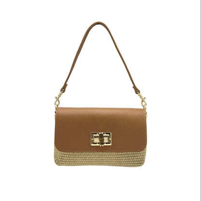 Tan and straw shoulder bag with a gold clasp on a white background