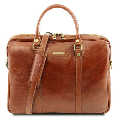 Prato leather laptop case close up showing rich brown grain, top handle and gold hardware.