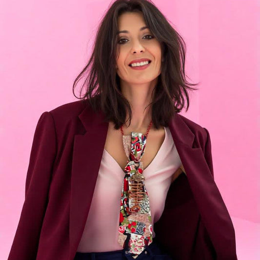 Model wearing the rose gold 4-in-1 jeweled tie over a blush top and burgundy blazer.