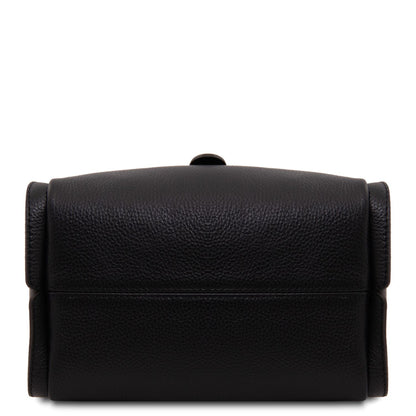 Close up of black pebbled leather bag with gold rectangular lock hardware