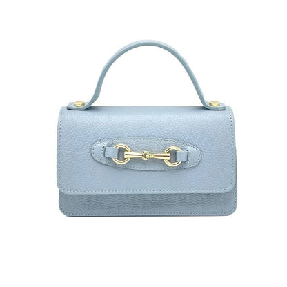 Light blue handbag with a gold horsebit clasp on a white background