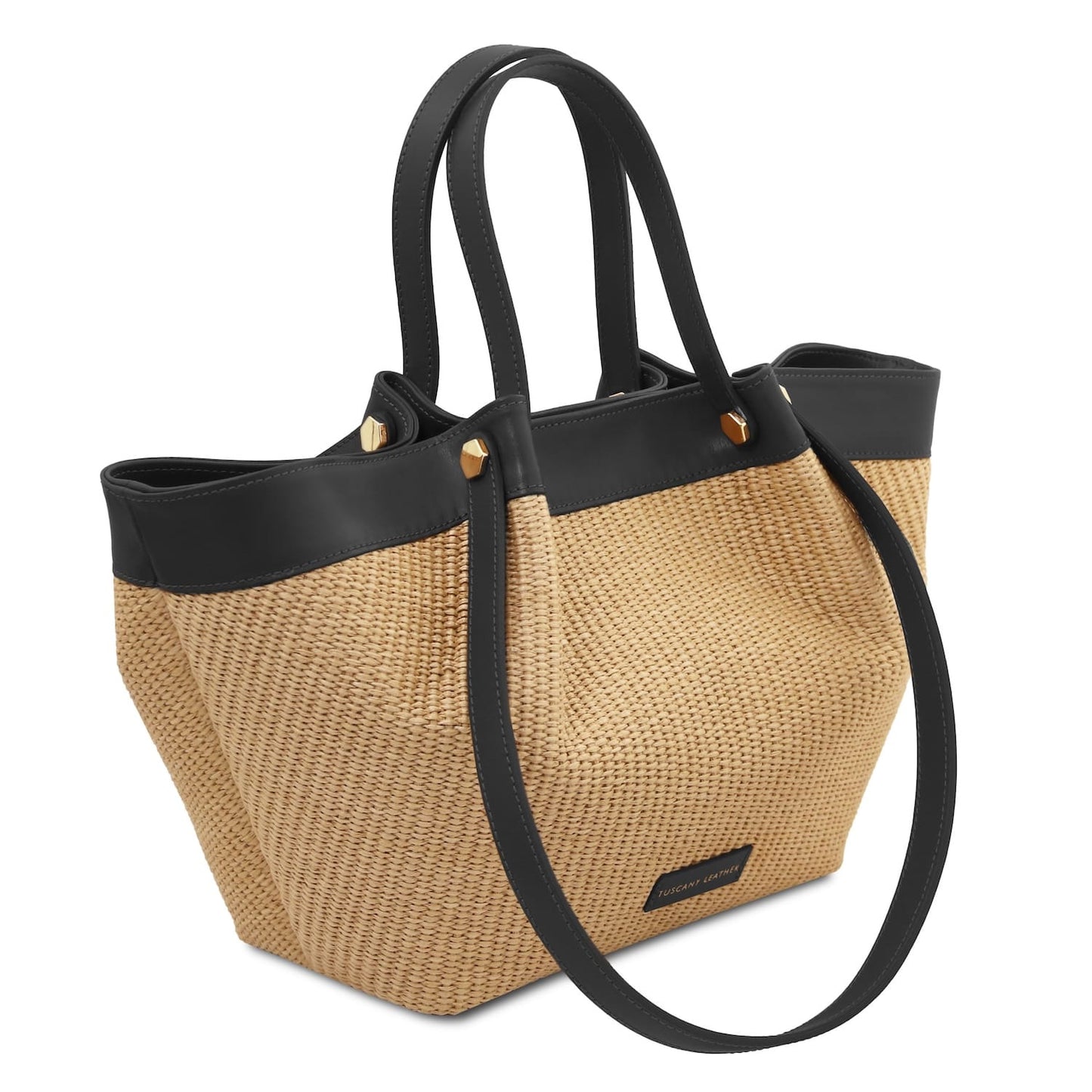 Soleil raffia shopping bag with black leather trim gold hardware and dual handles viewed from the side.