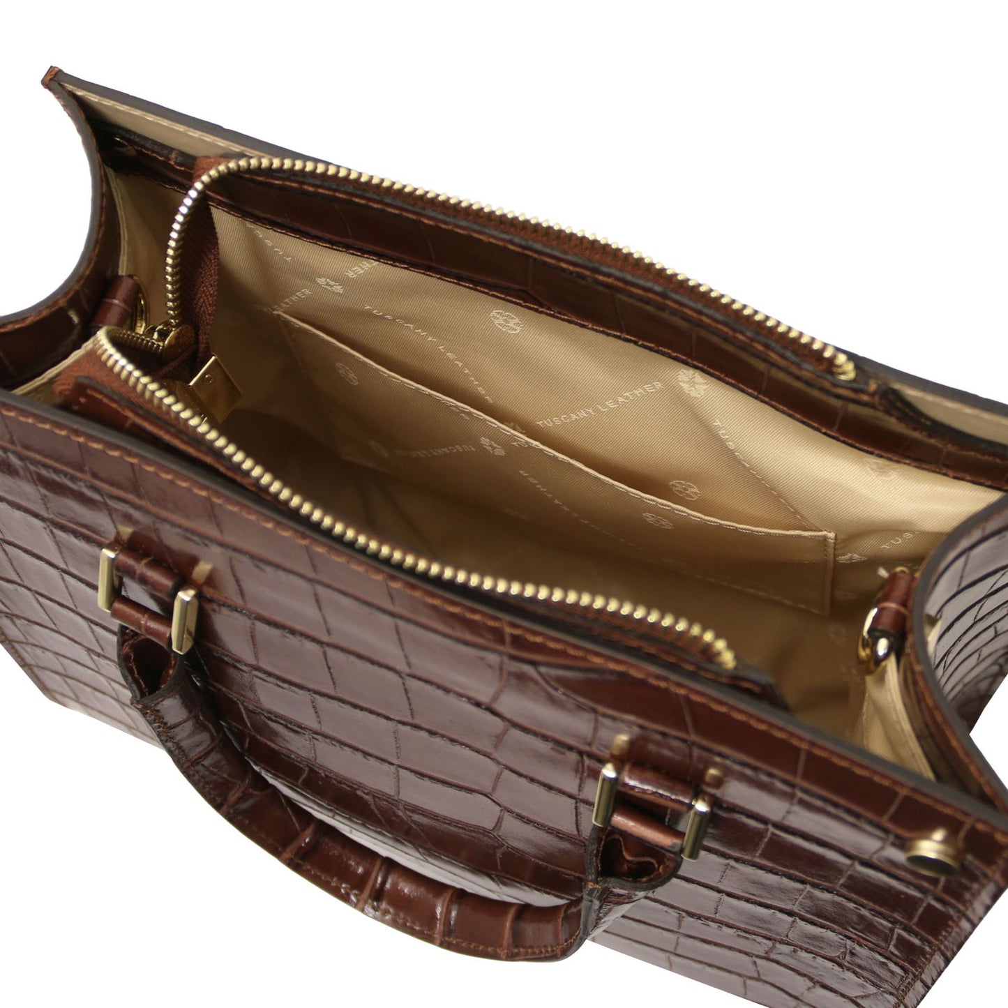 Brown crocodile skin handbag with gold hardware on a white background