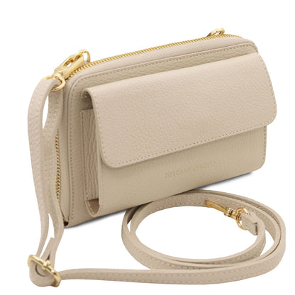 Beige pebble leather phone wallet with attached strap and gold zipper along the top