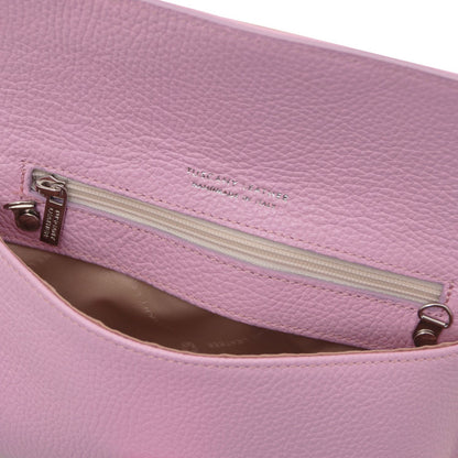 Interior view of pink leather clutch with zip pocket and tan lining