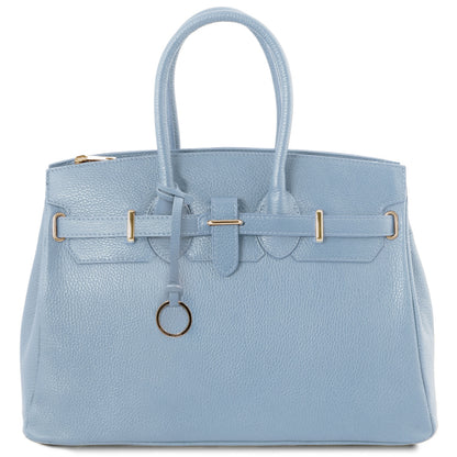 Light blue pebbled leather handbag with gold hardware, twin top handles, front belt strap and circular ring charm.