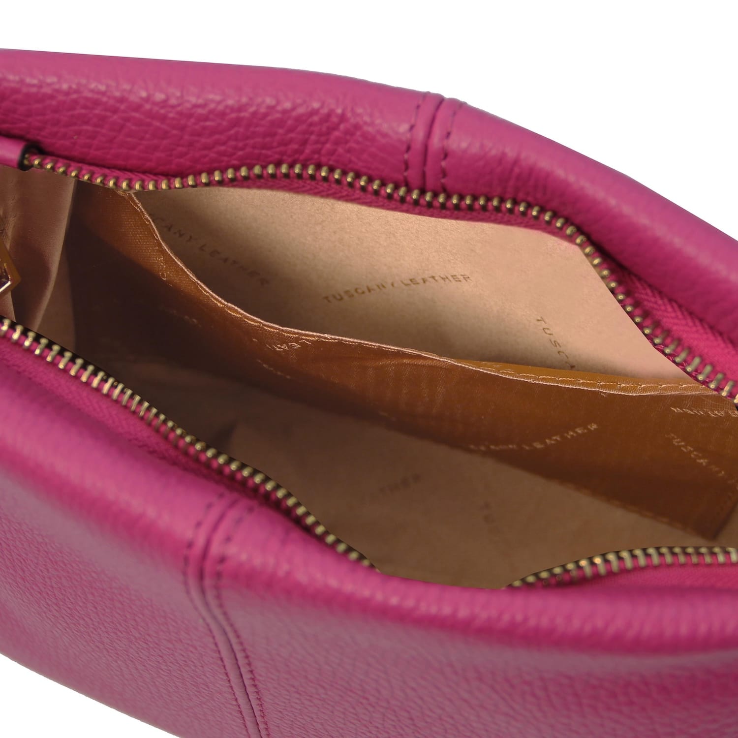 Close-up of a pink soft leather shoulder bag showing the interior with multiple compartments and a zipper closure.