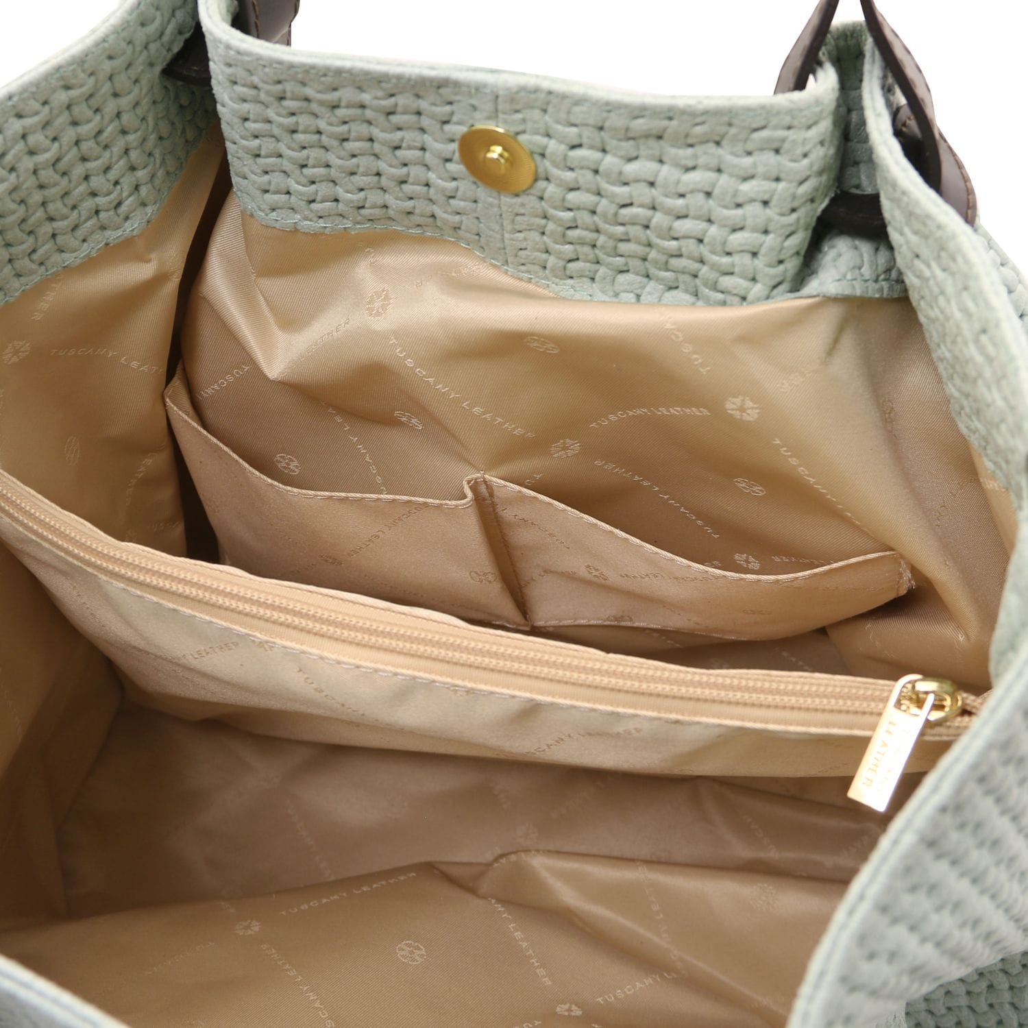 Interior of TL KeyLuck bag showing organization pockets and logo patterned lining