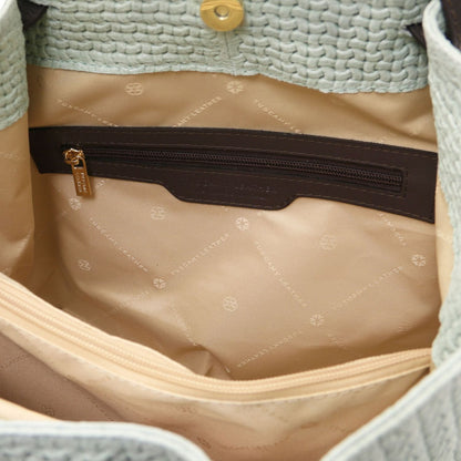 Interior view of TL KeyLuck woven leather bag with tan lining and a zip pocket