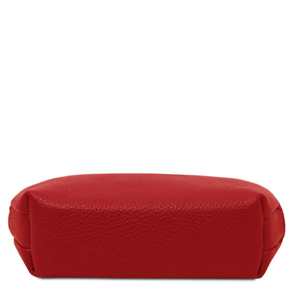 Bottom view of red pebbled leather Vera toiletry case.