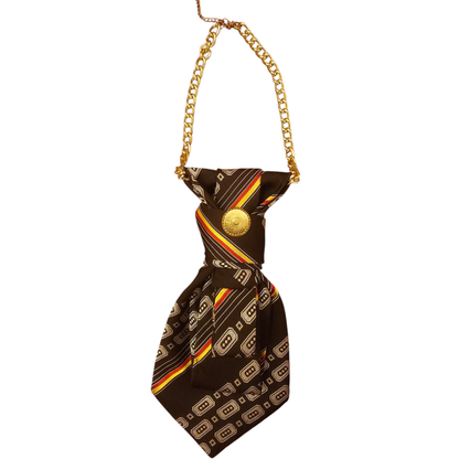 Close up of the brown patterned 4-in-1 jeweled tie with a gold chain on display.