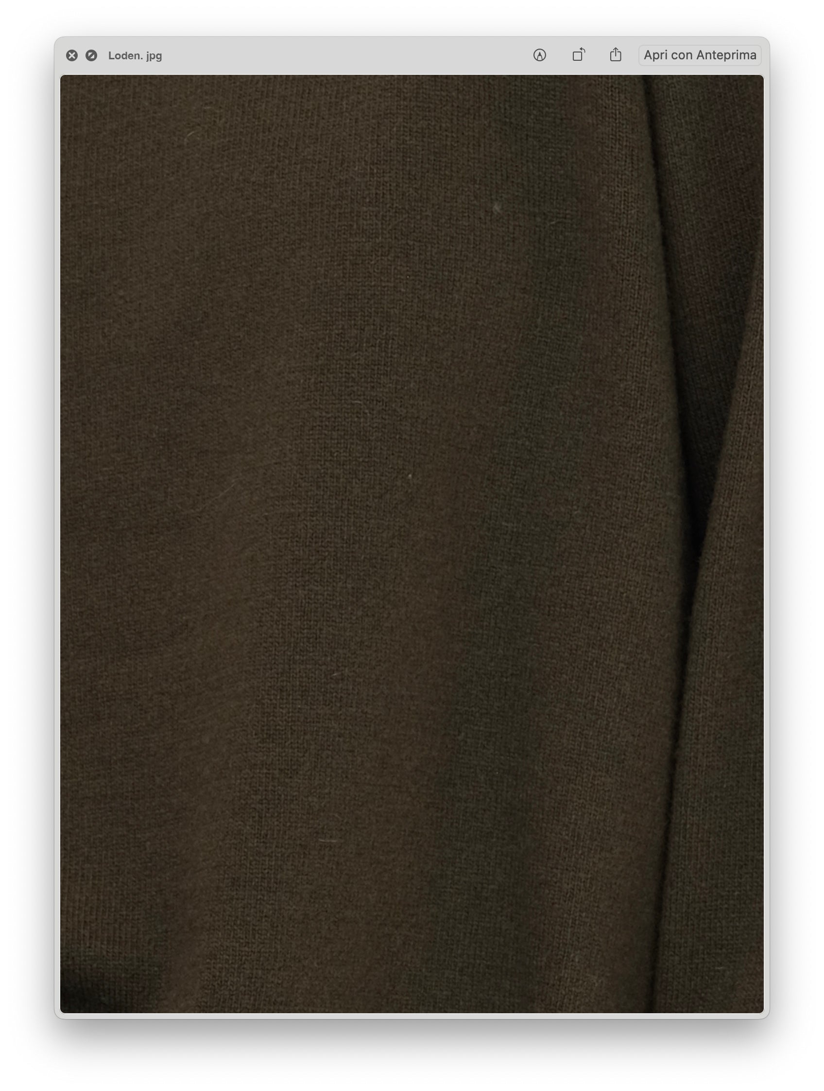 Close-up of the soft textured fabric in a muted olive tone of the Wool & Cashmere Mix High Neck Sweater with Zip.