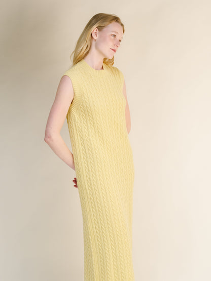 Wool & Cashmere Mix Sleeveless Cable Knit Dress in pale yellow featuring a detailed cable knit texture and a sleeveless silhouette.