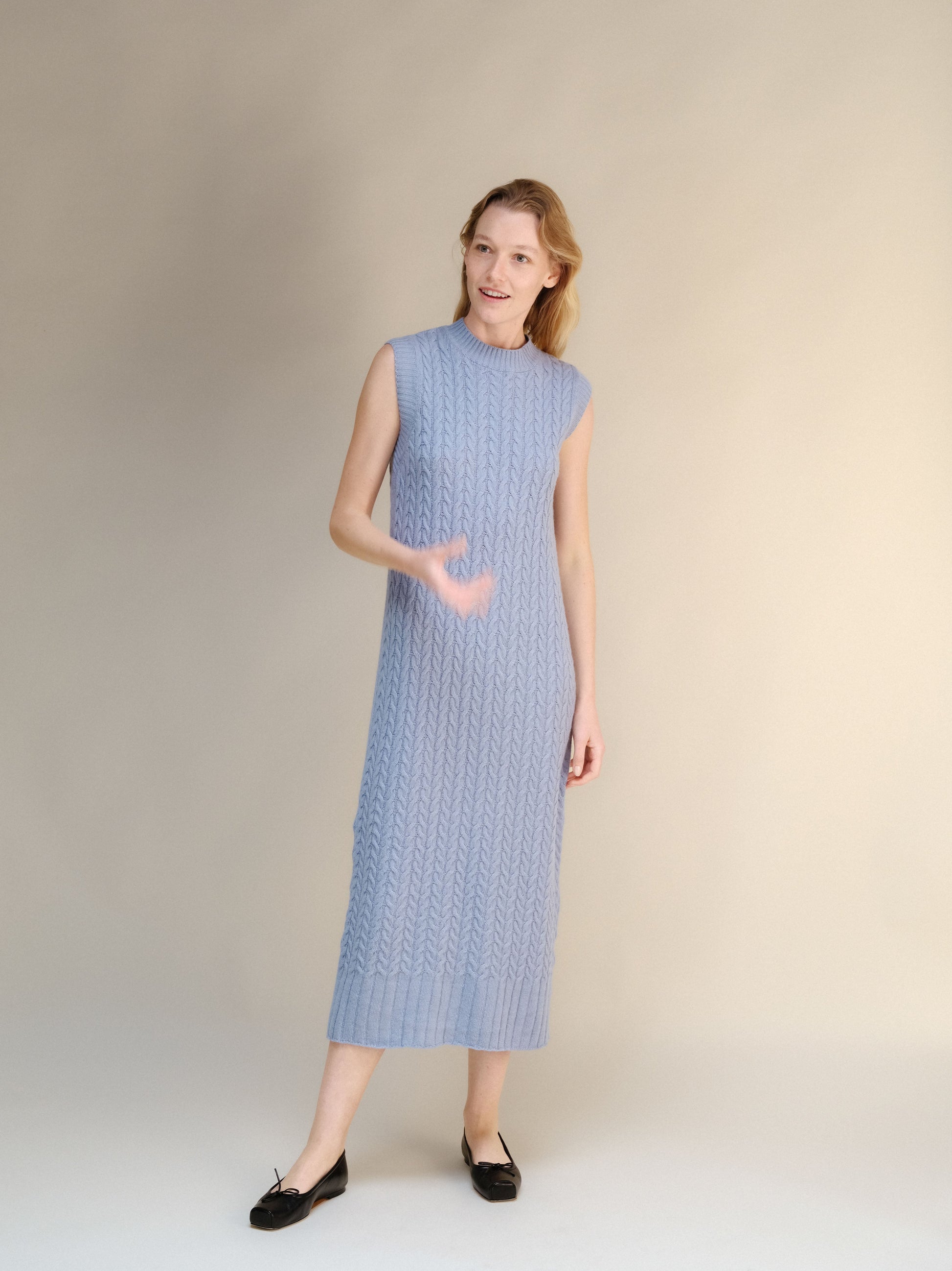 Wool & Cashmere Mix Sleeveless Cable Knit Dress in muted blue with a midi length and soft textured knit pattern.