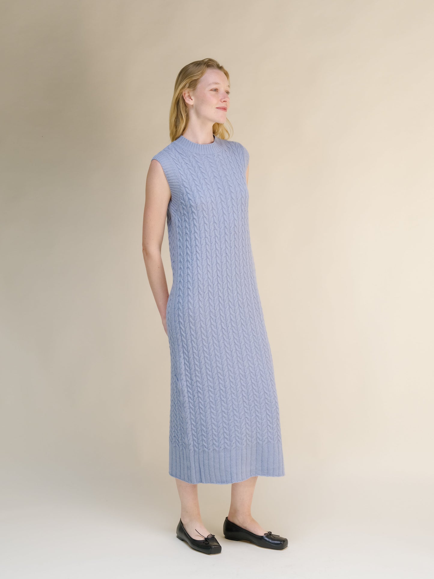Wool & Cashmere Mix Sleeveless Cable Knit Dress in a soft blue with a midi length and intricate cable knit detailing.